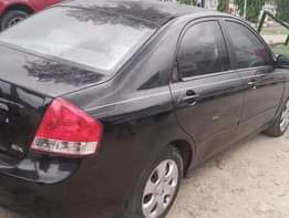 A picture of Kia cerato 2008 Engine has small top noise AC is