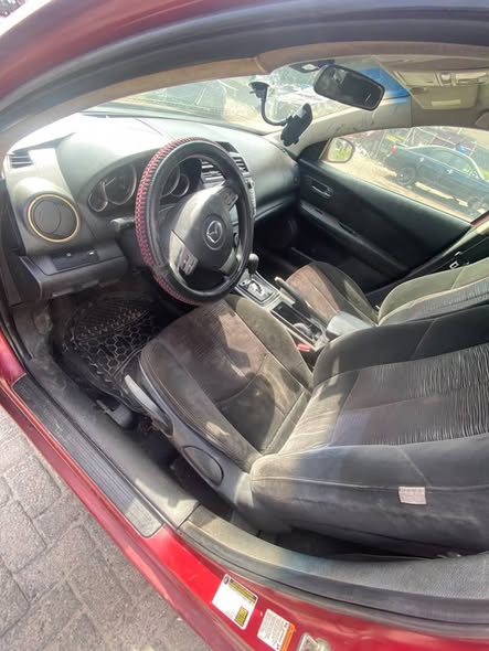 A picture of Uber standard 010 Mazda available for grab Engine n gear