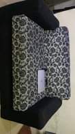 A picture of sofa and TV console