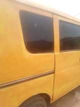 A picture of Susuki Mini Bus currently plying the road with gear that