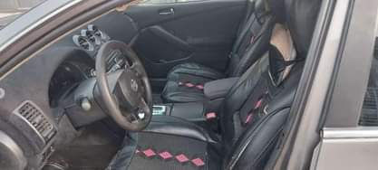 A picture of Neatly used Nissan Altima Bearly driven Thumb start Painted on