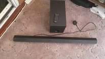A picture of Sony soundbar with remote