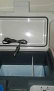 A picture of car camping travel office fridge
