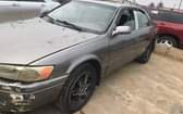 A picture of Registered 2000 Toyota Camry. Body need work.