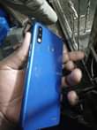 A picture of Tecno spark 3 with some cracks but working well clear