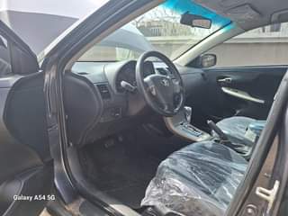 A picture of 09 Corolla super sharp with untampered engine and gear chilling