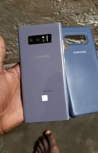 A picture of Samsung galaxy note 8 clean as new with a dot