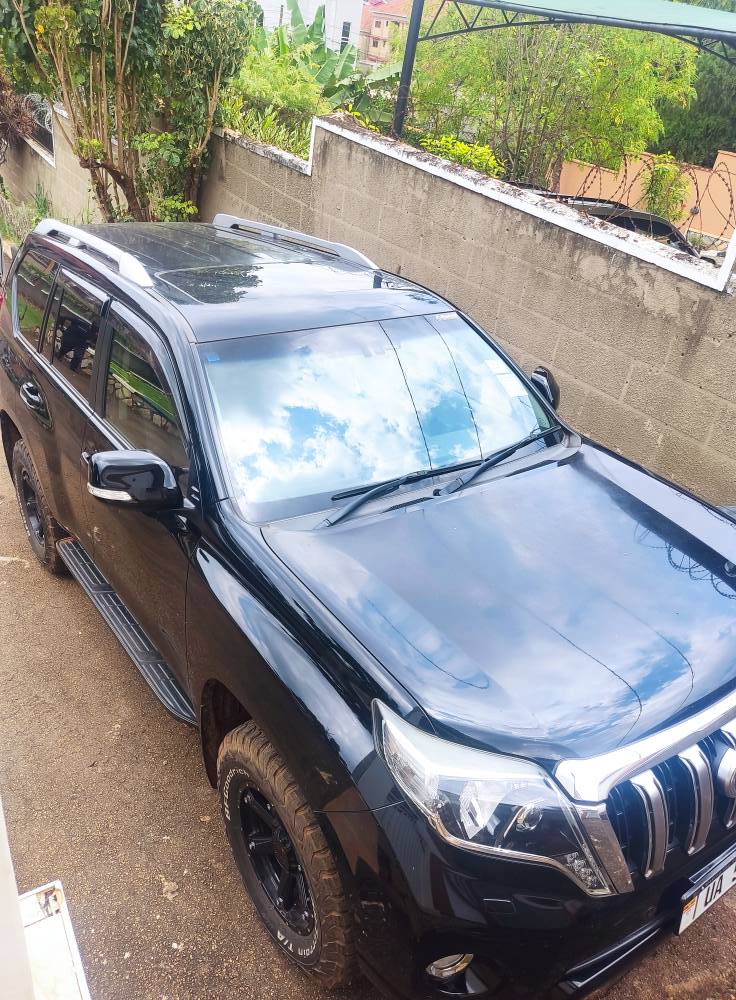 A picture of Chinese client leaving Uganda selling 8 months old Prado Tx