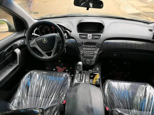 A picture of  NEATLY USED ACURA MDX MODEL 2008 MODEL AWD GREEN