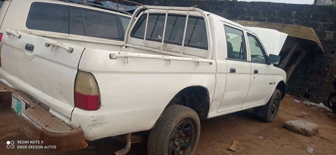A picture of First Body Mitsubishi L200 Pickup with Auxiliary