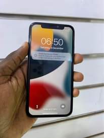 A picture of iPhone X 256gb faceid working 730k WhatsApp or call 0759979422