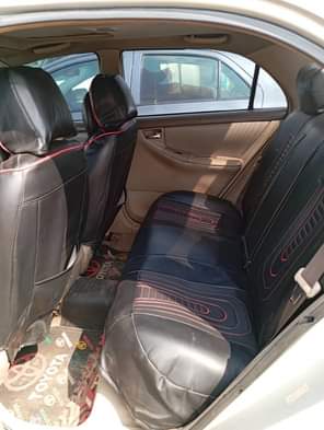 A picture of 2005 Corolla with android screen with pano roof buy and