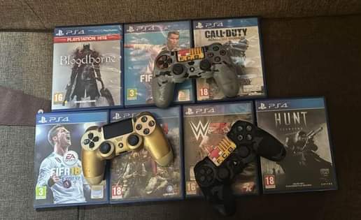 A picture of Ps4 pro 1TB with 5 games n 3 controllers 1.1M
