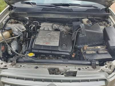 A picture of Distress Sharp highlander 2004 model with untampered engine accident free