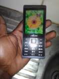 A picture of Original Tecno 528 button phone with the receipt