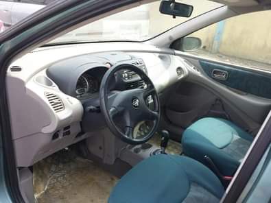 A picture of Clean Nissan Almera Tino Green colour Four airbags Factory A