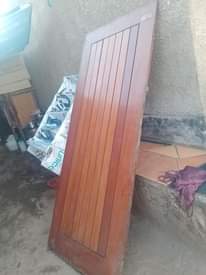A picture of 6 mahogany and one aluminium door
