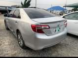 A picture of Toyota Camry 2014 Pure firstbody Clean in and out Toks