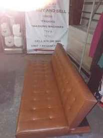 A picture of BROWN LEATHER SLEEPER COUCH IN A GOOD CONDITION