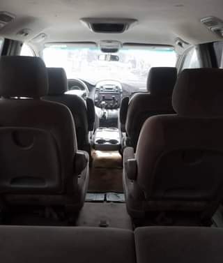 A picture of Clean Nigerian Used Grey Toyota Sienna 2005 Repainted Fabric interior