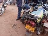A picture of Bajaj boxer and TVs