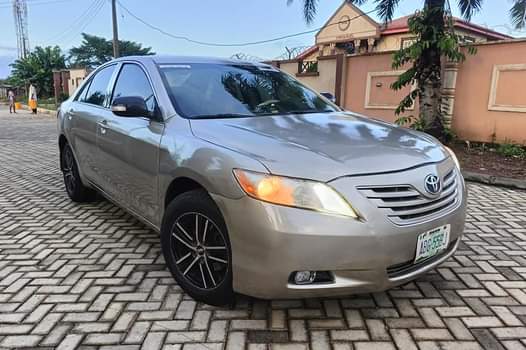 A picture of 2008 Toyota Camry painted Available 4sale or swap Deal Call