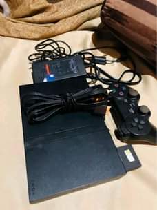 A picture of PS2 FULLSET 7 games and one pad for sale at