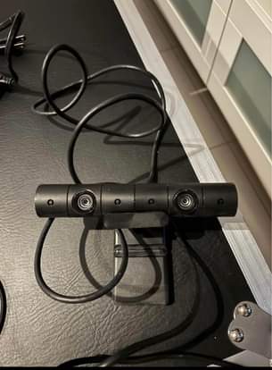A picture of PS4 1tb with 2 controllers with VR plus 10 games