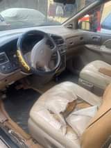 A picture of 2000 Toyota Sienna partially first body untempered engine and gear
