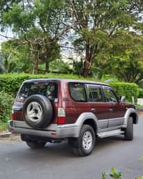 A picture of TOYOTA PRADO Year. 2000 Colour Maroon Engine 1Kz Gear. Automatic