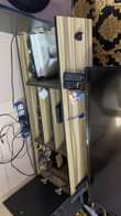 A picture of sofa and TV console