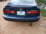 A picture of Toyota Camry tiny light very clean interior sharp body engine