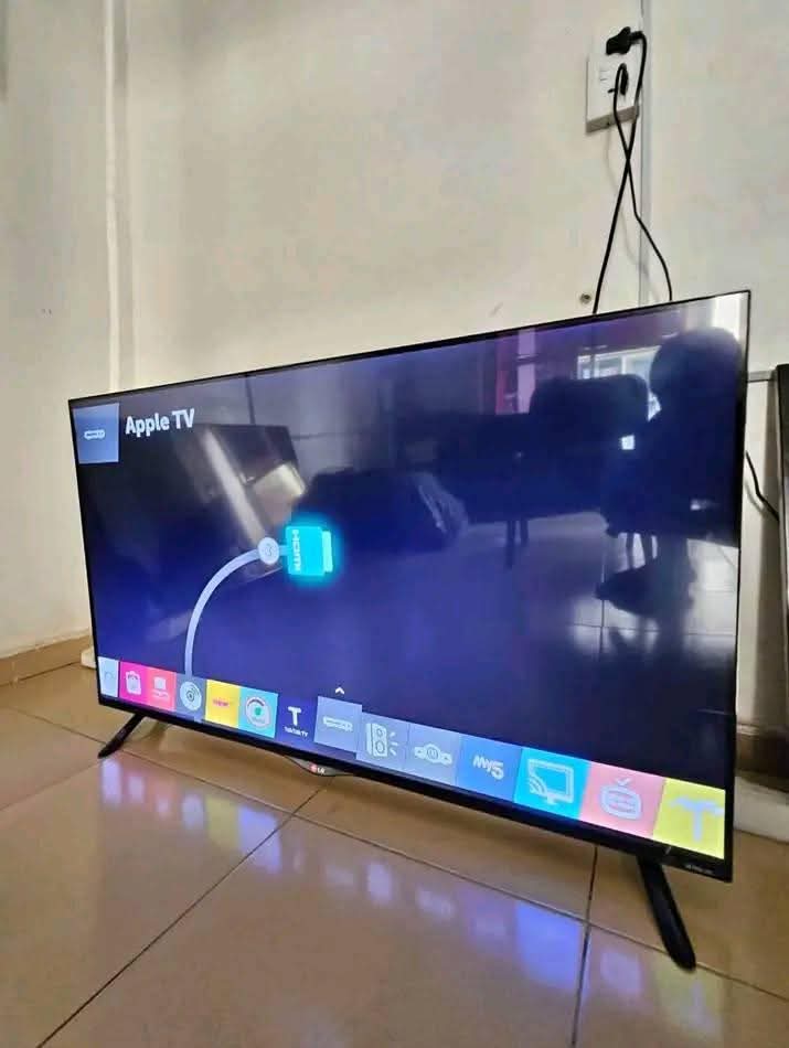 A picture of 70inch LG frameless smart TV 4k with phone WiFi network