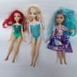 A picture of Barbie dolls