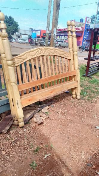 A picture of It s a used 5by6 wooden bed in good condition