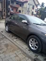 A picture of 2010 model of Toyota Corolla engine body ac very okay