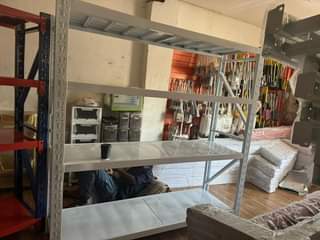 A picture of supermarket shelves for storage and trolly on sale 380k 0776182539