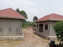 A picture of 3 houses for sale at Bombo Kalure near St Janan