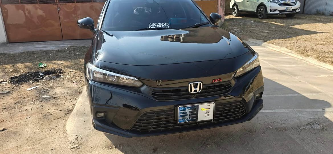 A picture of HONDa Civic Oriel 2025 Black with burgundy