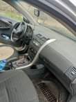 A picture of Corolla 2010 for sale Body work needed painting precisely Engine