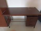 A picture of Wooden office desk table with three drawers
