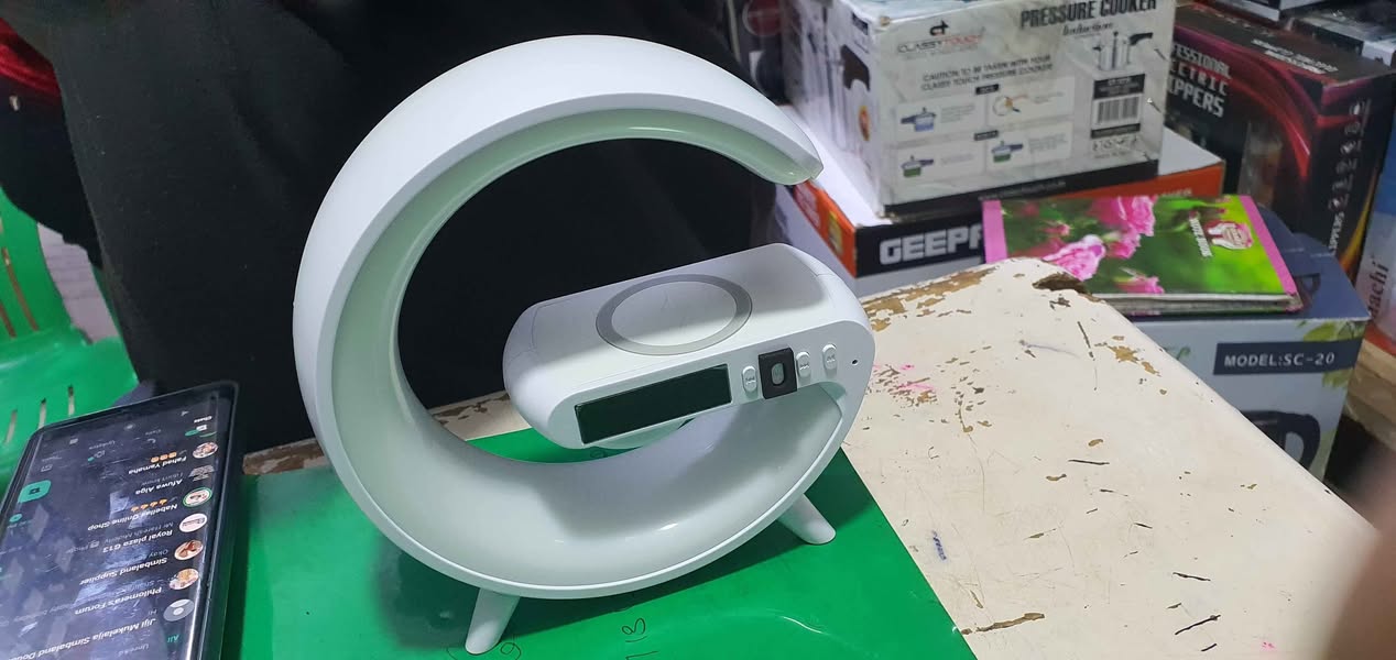 A picture of Wireless Charger Speaker Portable Wireless Speaker Alarm Clock Mp3 Player