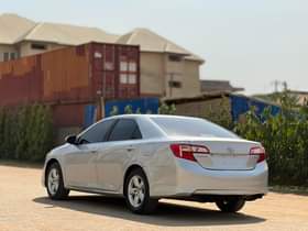A picture of SUPER CLEAN SLIGHTLY USED UNREGISTERED 2014 TOYOTA CAMRY 7 5M