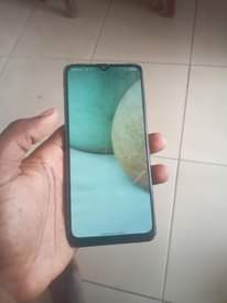 A picture of Samsung a12 aina kipengele chaji inakaa sana camera clean 0620490740
