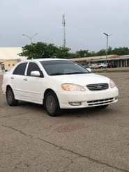 A picture of WHITE Nigeria Used Toyota Corolla LE 2004 Model With Custom