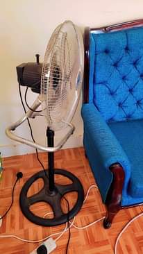 A picture of Curtains suitcase fan and mattress
