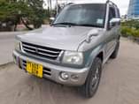 A picture of PAJERO MINI FULL DOCUMENT TSH 9 800 000 CALL 0712973480