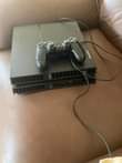 A picture of Sony Ps 4 with FIFA 2022 spider man and call