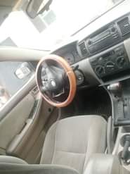A picture of Toyota Corolla red with silent engine sharp gear and chilling