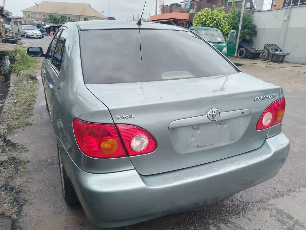A picture of Toyota Corolla. 2003 model. Tok standard Working perfectly. Fabric Seats.